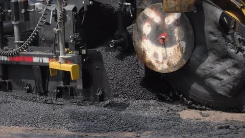 Roadwork Development with New Asphalt Road Person is Going By with Shovel