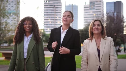 Three Women Standing in Front of Office Building