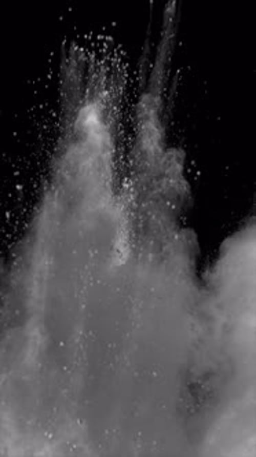 White Powder Exploding on Black Background Vertical Video