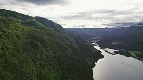 Breathtaking View Of Mountain River Surrounded By Verdant Peaks
