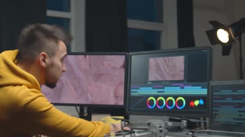 Freelance Videographer Colorist Editing Footage Using Professional Software Monitor and Montage