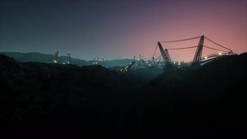 Industrial Open Pit Mine with Large Dragline Excavators and Machinery at Sunset