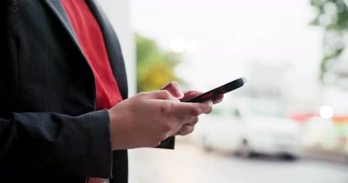 Phone, closeup and businesswoman typing in the city for networking on social media or the internet