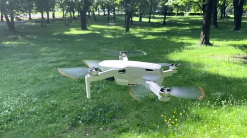 Amazing Arc Closeup Shot of Drone Hovering in Green Park