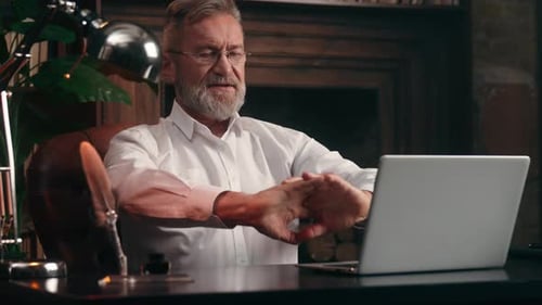 Motivated Caucasian Old Retired Business Man Stretching Fingers Hands Start Working Laptop Online