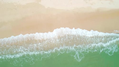 Aerial View of Sandy Beach and Turquoise Ocean Top View of Ocean Waves Reaching Shore on Sunny Day