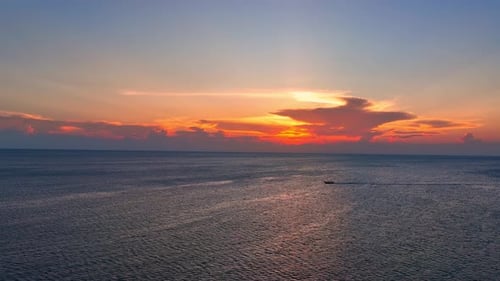 Aerial view drone flying over sea waves during sunset. 4K.