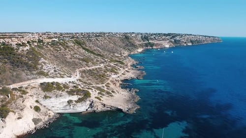 Aerial drone shot in 4k of the beautiful rocky coastline of the balearic island Mallorca with clear