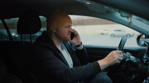 Angry Man Driver Speaking on Smartphone on Highway