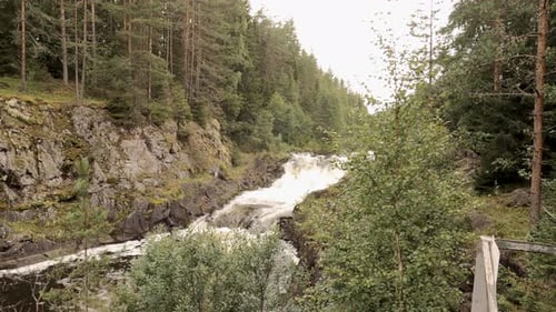 Rocks and rocky rifts on a mountain river in summer. View on the valley and the river Iset with rock
