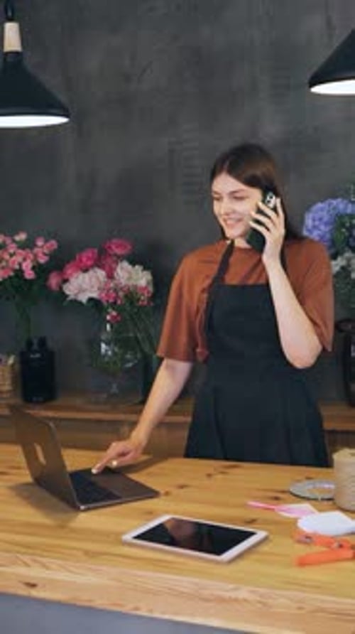 In a Charming Flower Shop a Skilled Florist Takes Orders and Creates Beautiful Bouquets Showcasing