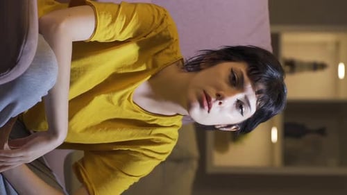 Woman Experiencing Headache or Neck Pain Indoors