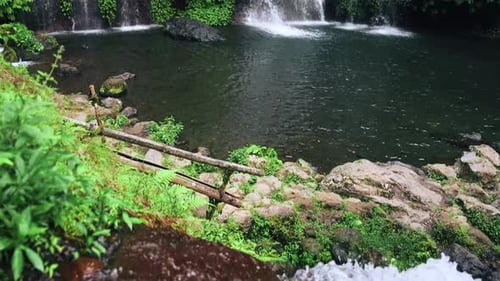 View on Water of Mountain Waterfall Falling in Green Nature of Forest Landscape