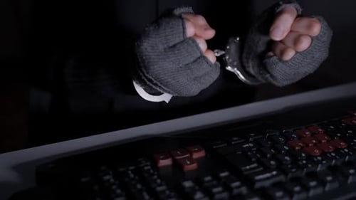 Hacker with Handcuffs On