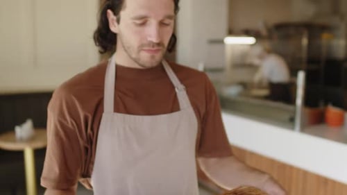 Baker Proudly Presents Fresh Baked Croissants in Cafe