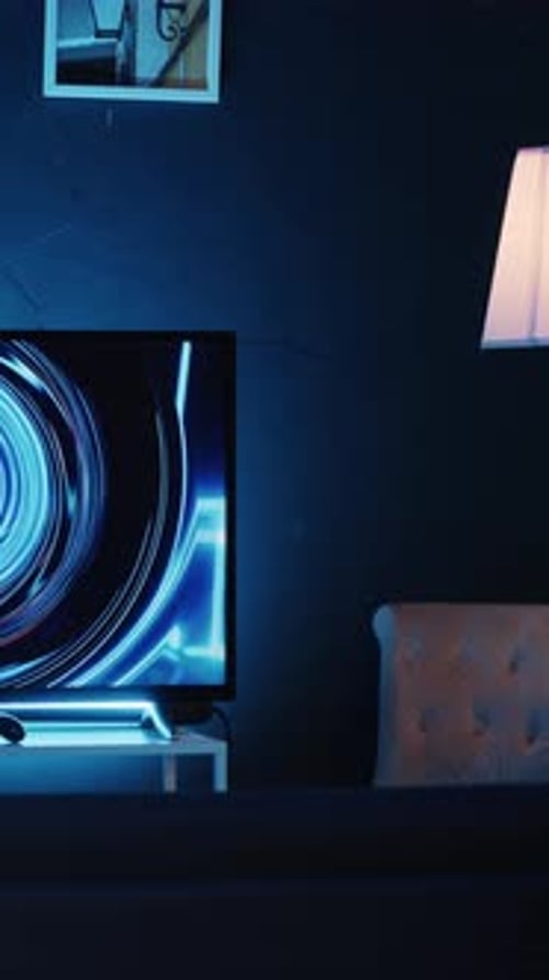Vertical Video TV Screen Showing 3D Render Animations in Empty Stylish Neon Lit Home Studio Interior