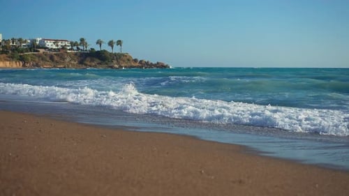 Wide Shot Azure Blue Mediterranean Sea Waves Rolling on Golden Sand on Cyprus Tourist Resort Ocean