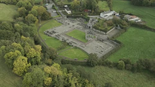 Ancient Mellifont Abbey ruins surrounded by green countryside in County Louth, Ireland