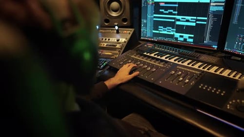 Professional Audio Engineer Using Digital Workstation in Modern Record Studio Music Production in