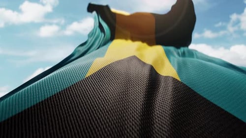 Bahamas National Flag Waving Against Blue Sky
