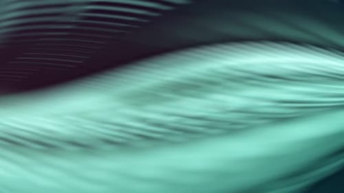 A blurry blue and green background with a wave-like effect