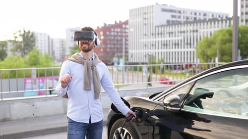 Man in VR Charging Electric Car