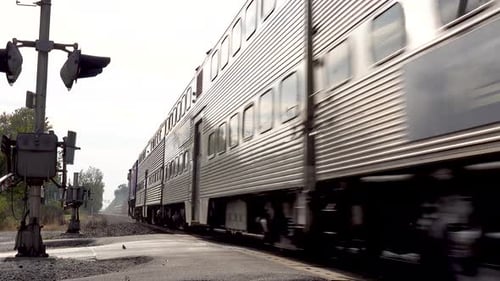 Close-Up of Fast Commuter Train on Railroad Tracks