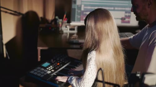 Girl Enjoys Playing Keyboard in Studio