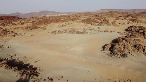 Aerial view of desert landscape with rocky formations