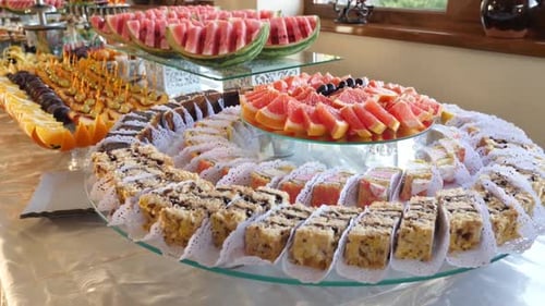 61q. Sweet, buffet table with cakes, pies, cookies with glaze.