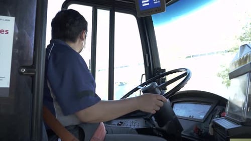 Bus Driver Operates Public Transportation in the City