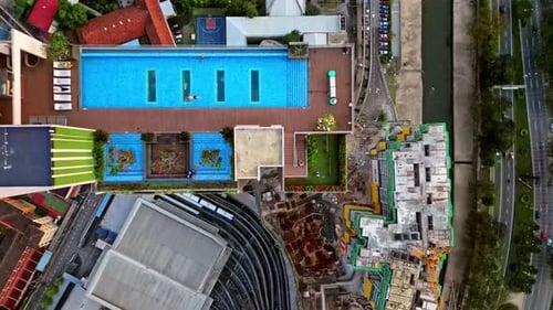 Aerial view of swimming pool and construction, Malaysia.