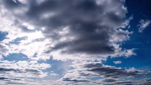 Timelapse of Cumulus Clouds Moves In The Blue Sky