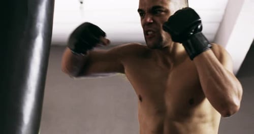 4k video footage of a young male boxer practicing in the gym