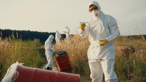 Hazmat Team Investigating Toxic Waste Leak in Marshland