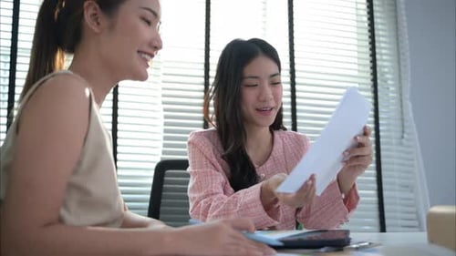 Couple of Business People Working Together at Modern Office