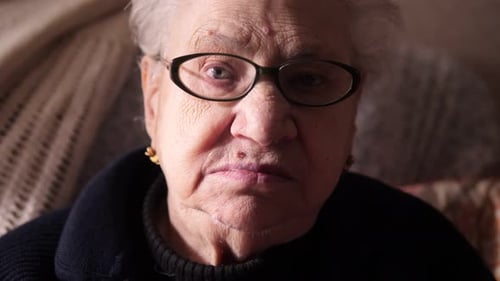Senior Woman's Face with Glasses, Close Up