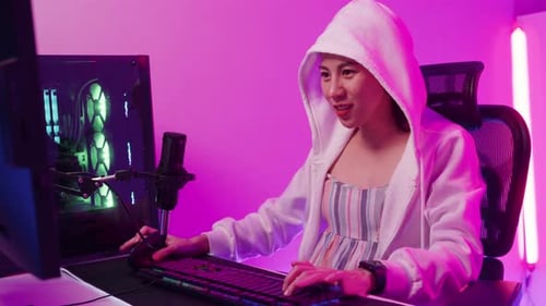 Excited Woman Gamer Playing Video Game Online