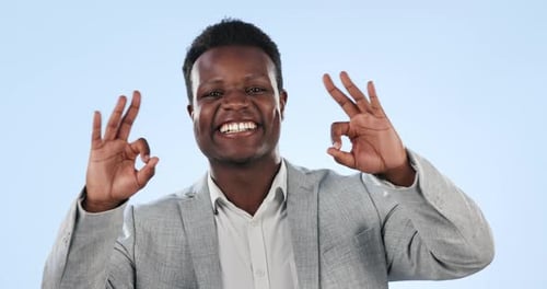 Face, perfect or happy black man in studio isolated on blue background for feedback