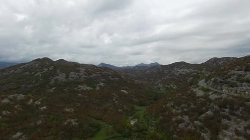 A Breathtaking Scenic View of a Magnificent Mountain Landscape Set Beneath Cloudy Skies