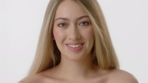 Blonde Woman Smiling in Close Up Studio Shot