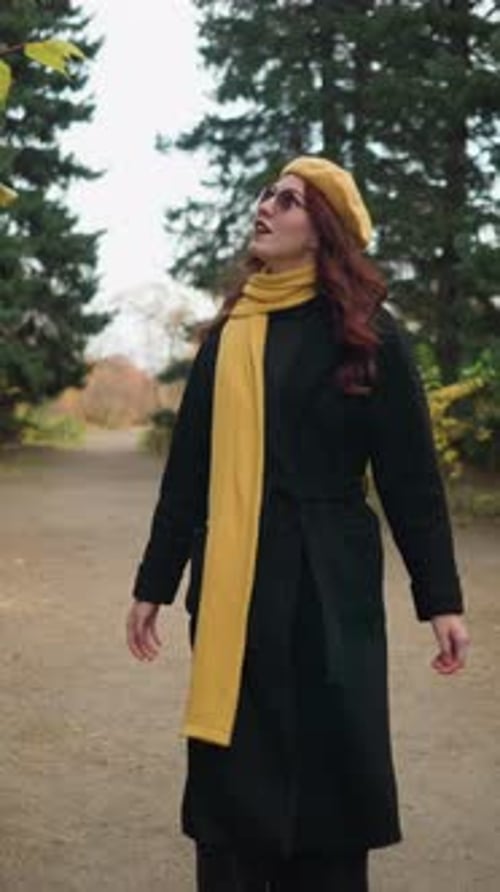 Autumn Stroll Woman Adjusts Yellow Beret in Colorful Garden
