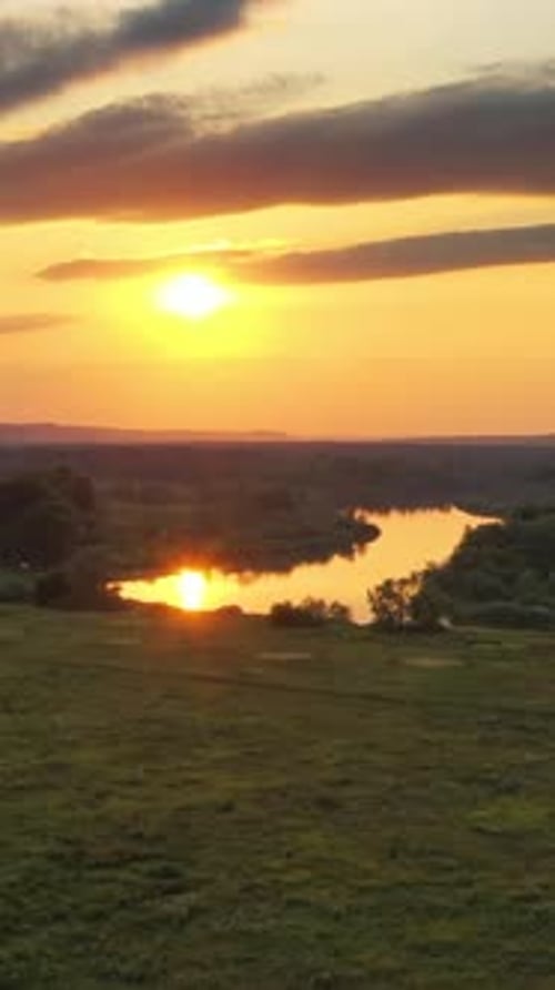 sunrise or sunset with forest and river