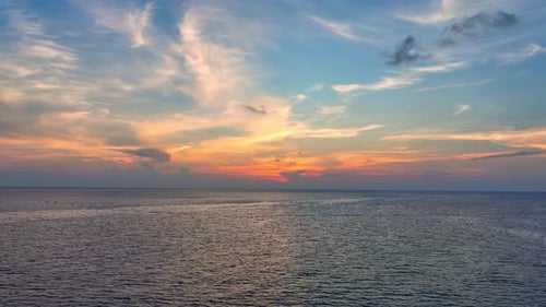 Aerial view drone flying over sea waves during sunset. 4K.