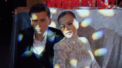 Beautiful Young Couple Posing in Elegant Setting