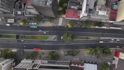 Aerial View of a City Intersection with Buses and Cars Timelapse