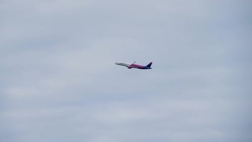 The Plane Takes Off From the Airport on the Background of the Sky