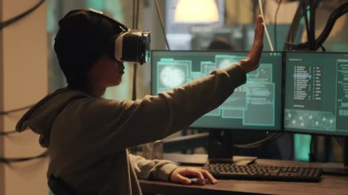 Young Adult Immersed in Virtual Reality at Desk