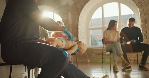 CPR Training on Baby Doll with Adult Students