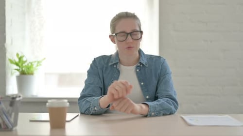 Young Woman Blogging Online Doing Video Chat in Office